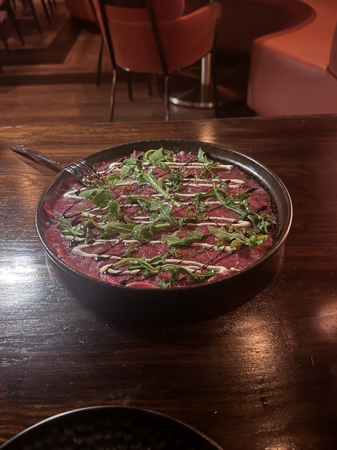 Beef carpaccio first course at Aris Mediterranean Steakhouse in Austin