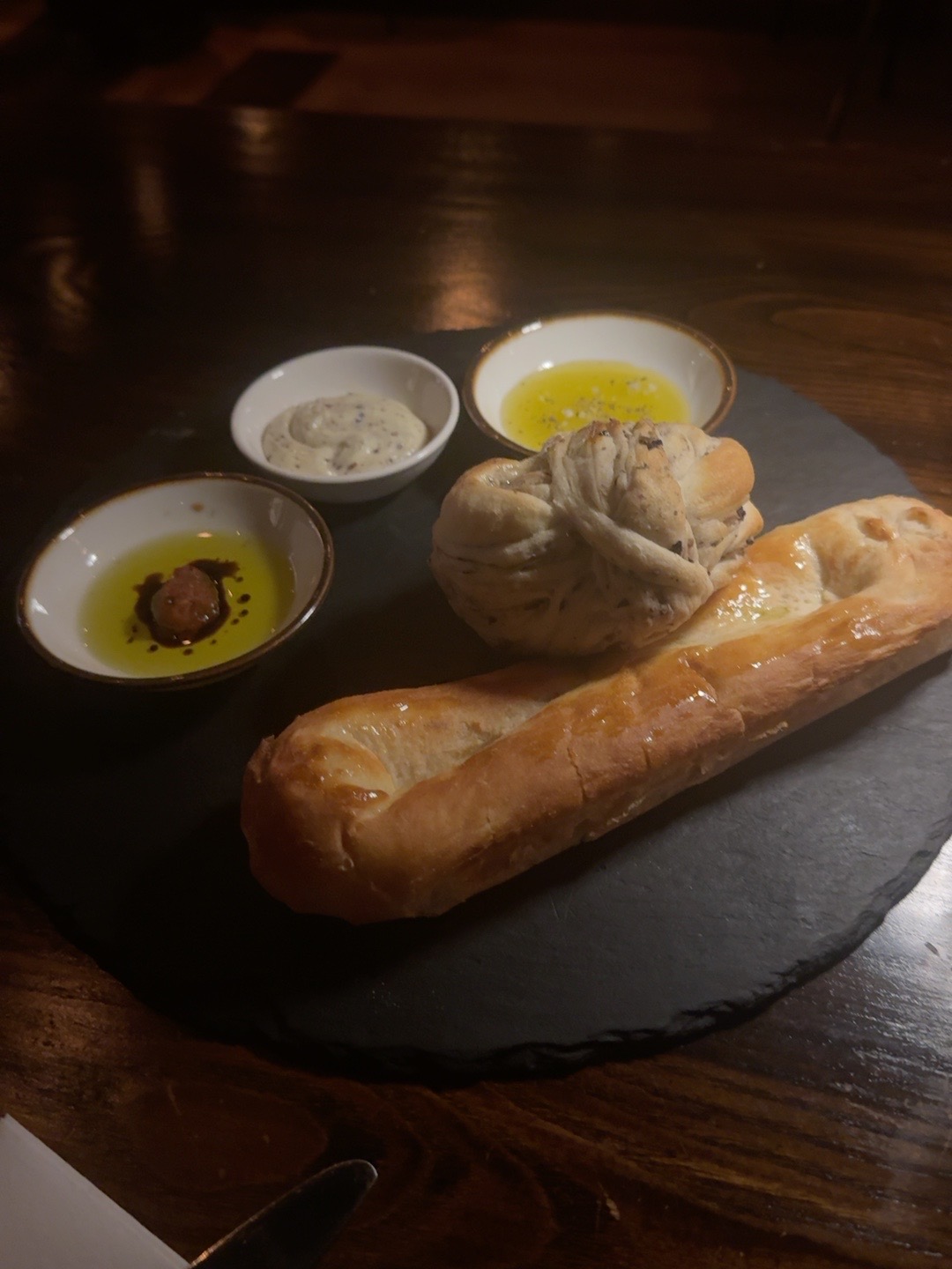 Bread course with hummus and accompaniments at Aris Mediterranean Steakhouse