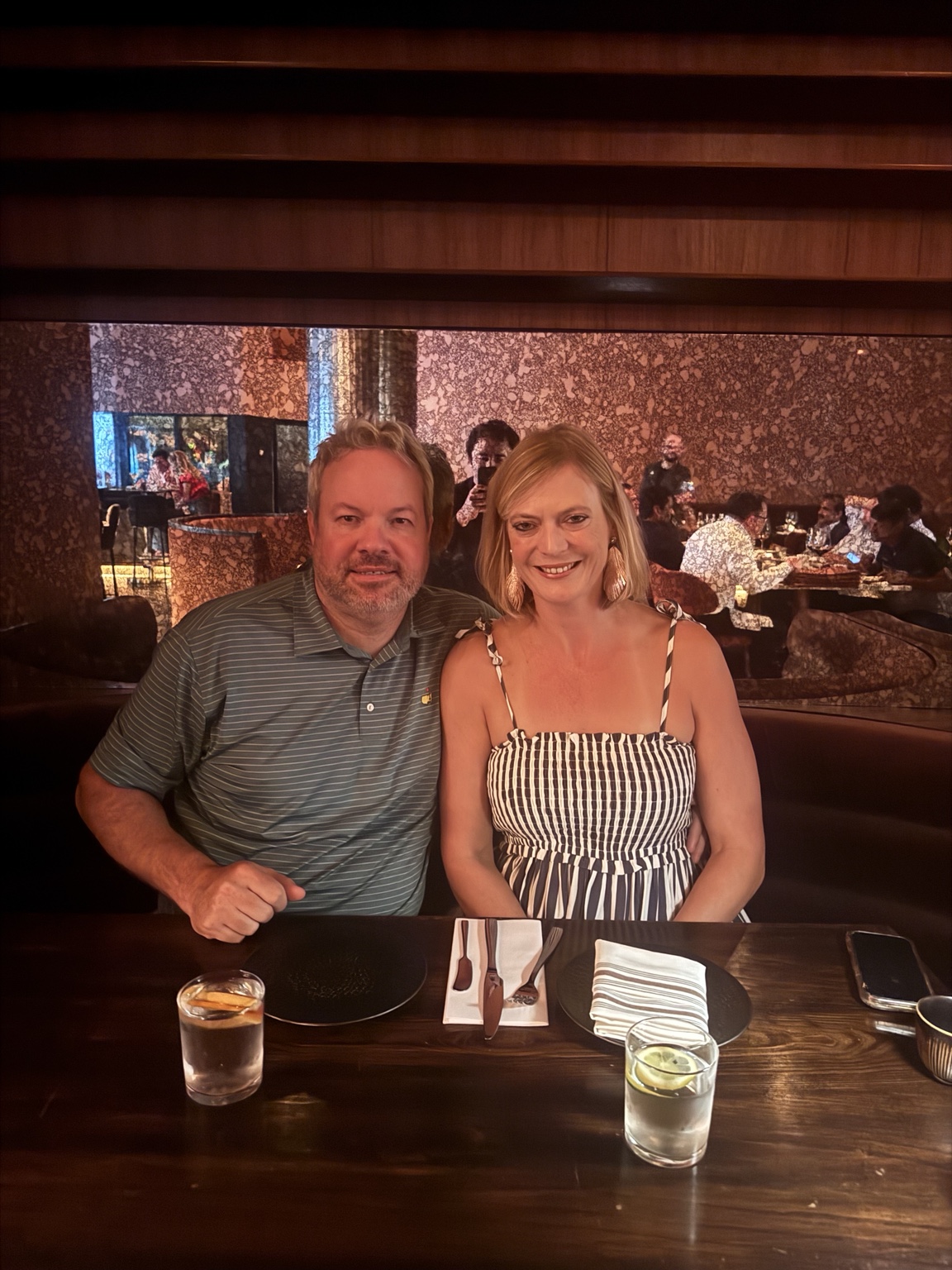 Mark and Jen seated for date night at Aris Mediterranean Steakhouse in Austin
