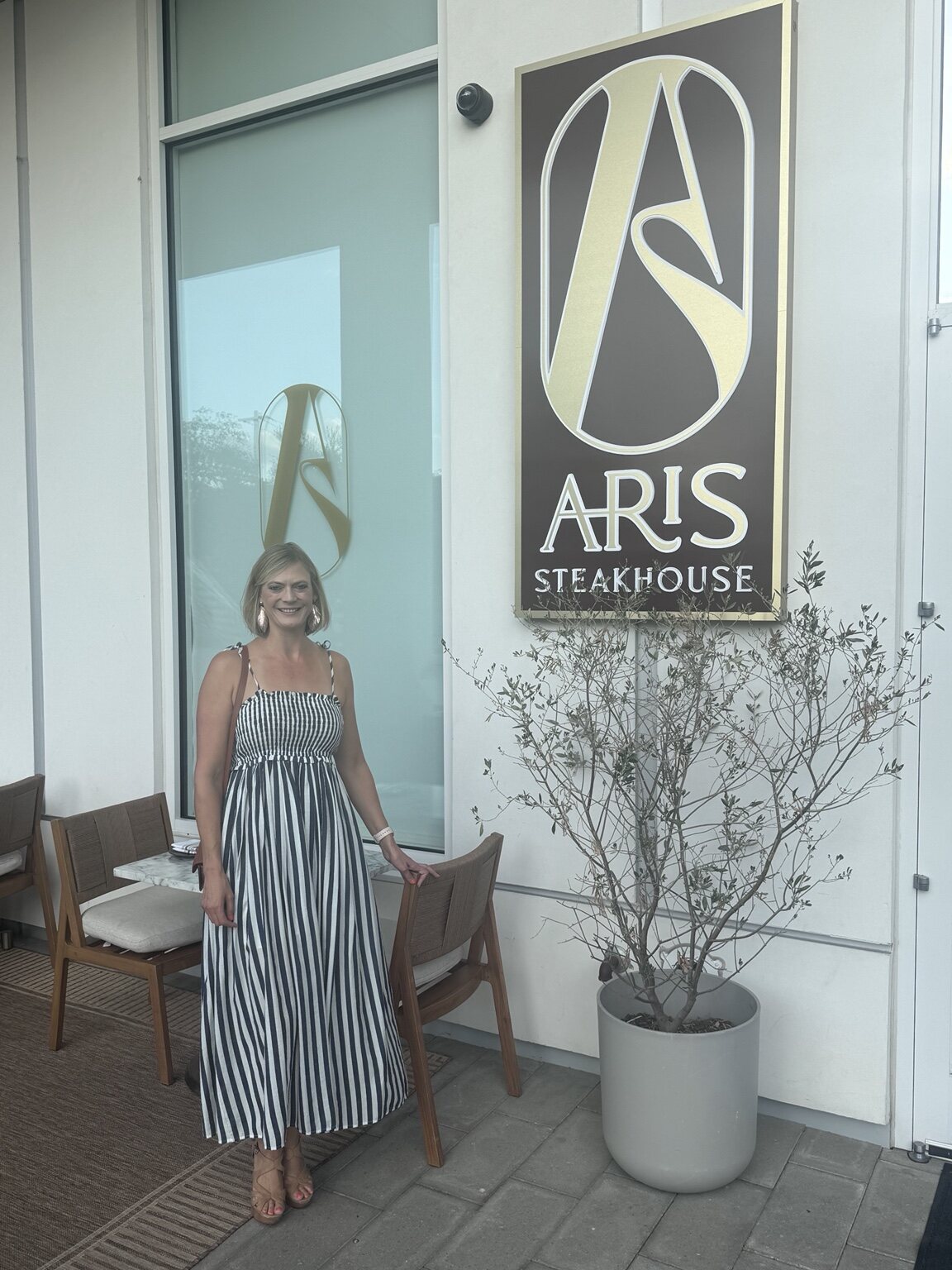 Jen outside Aris Steakhouse in Austin