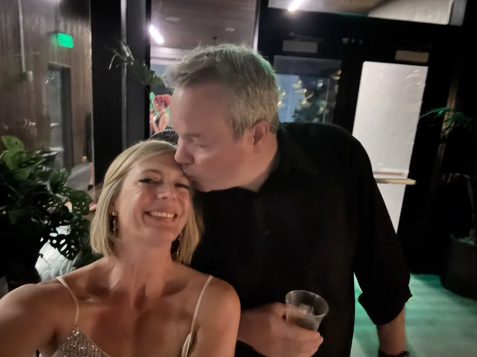 Mark kissing Jen during her birthday date night