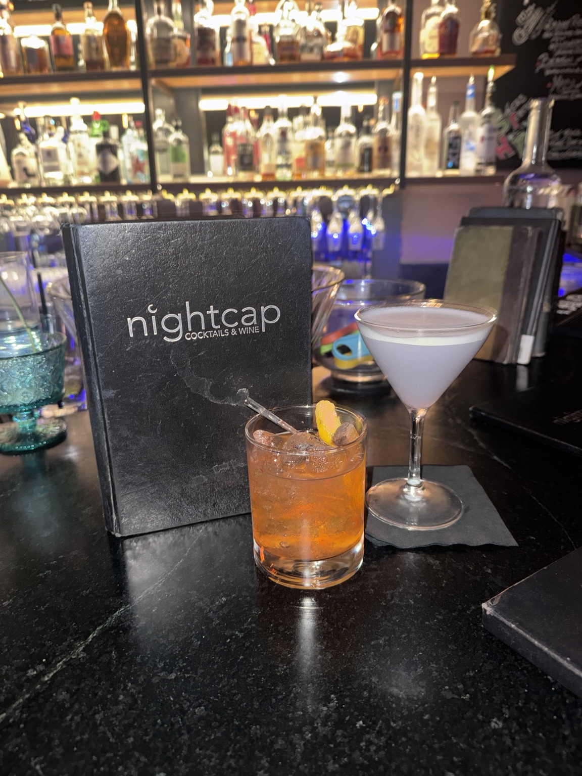 The West Egg cocktail with vodka substitution and Whiskey Business cocktail at Nightcap in Austin