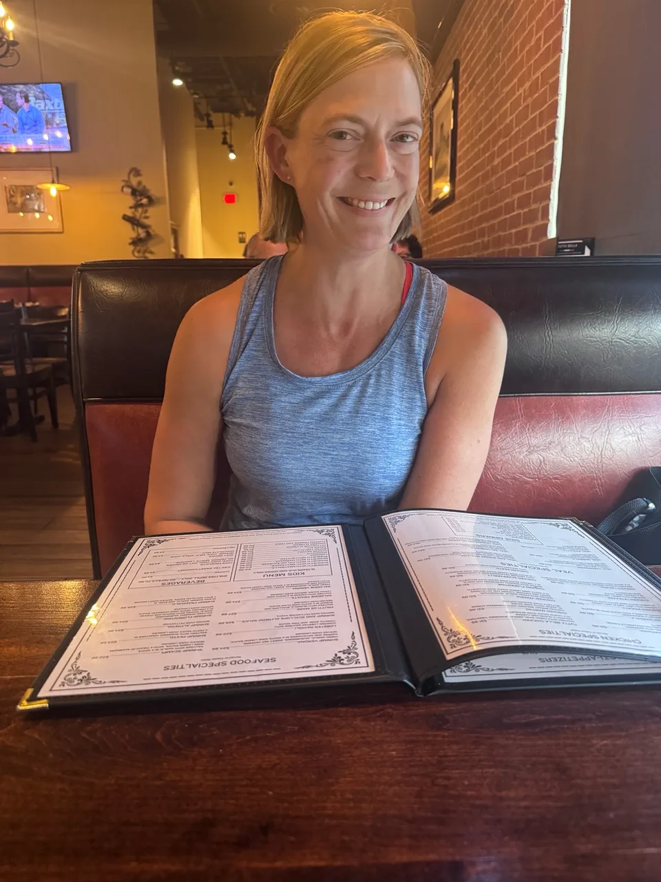 Jen at Tutta Bella with the menu